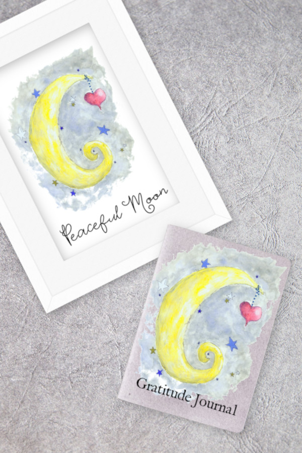 watercolor moon on framed art and gratitude journal