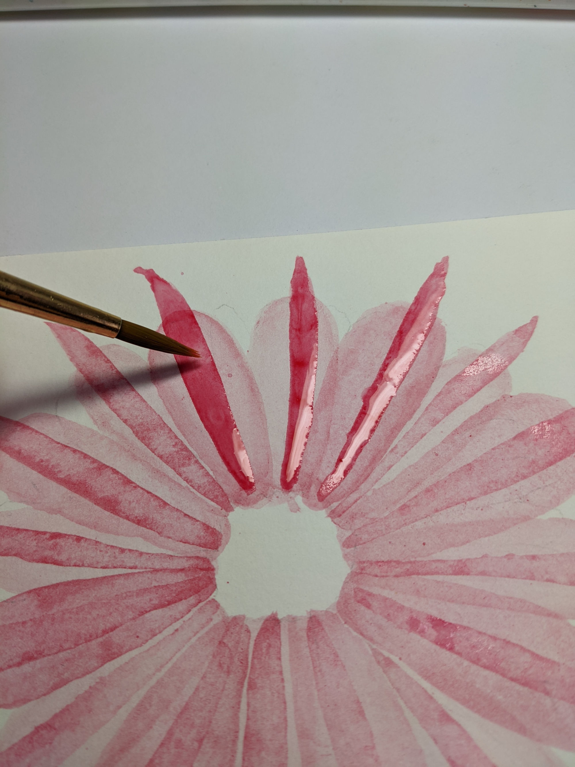 adding the final layer of petals on an abstract pink transparent watercolor flower